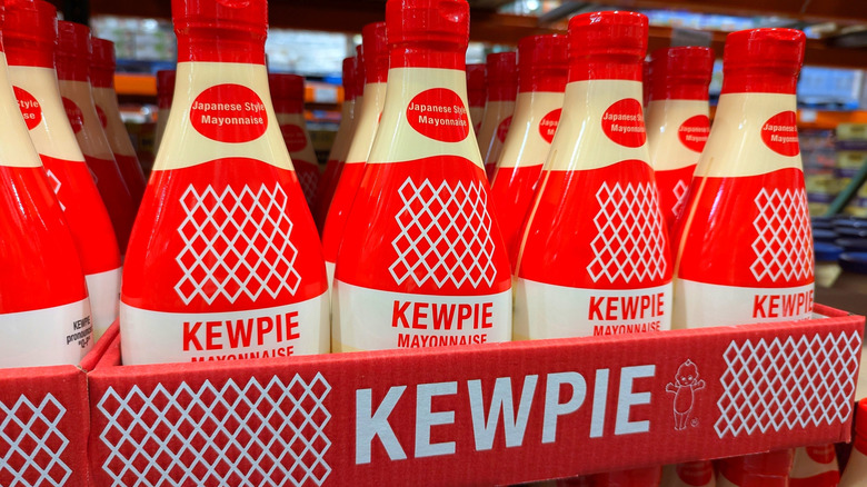 Kewpie bottles lined up on grocery store shelf