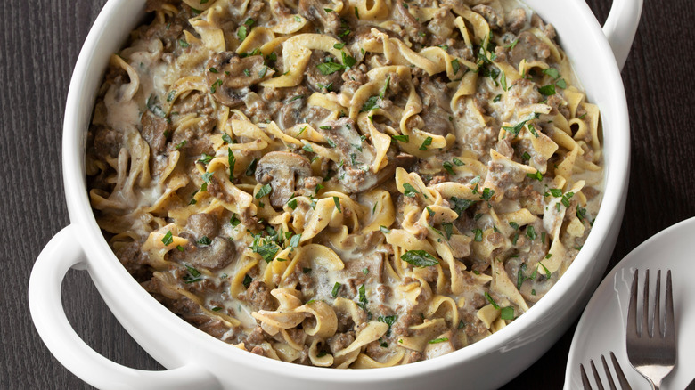 Large white casserole dish of beef stroganoff