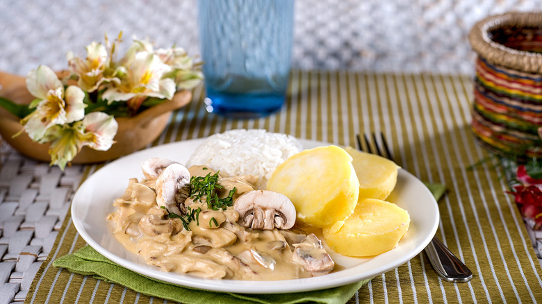 Chicken a la king with rice and potatoes