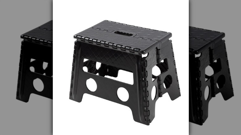Mainstays folding step stool on a white background.