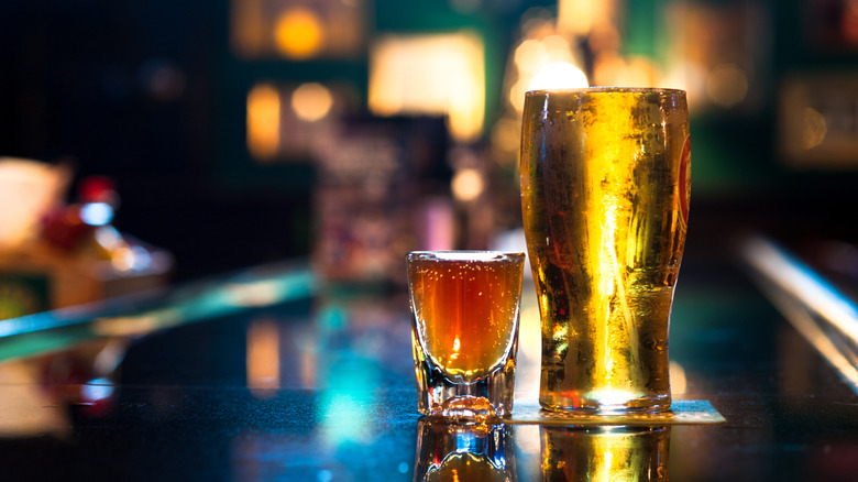 A shot and a beer on a bar