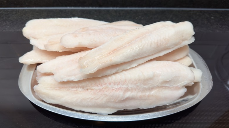 Stack of frozen panga fillets on a plate