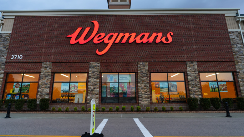 A brick Wegmans store with a red sign