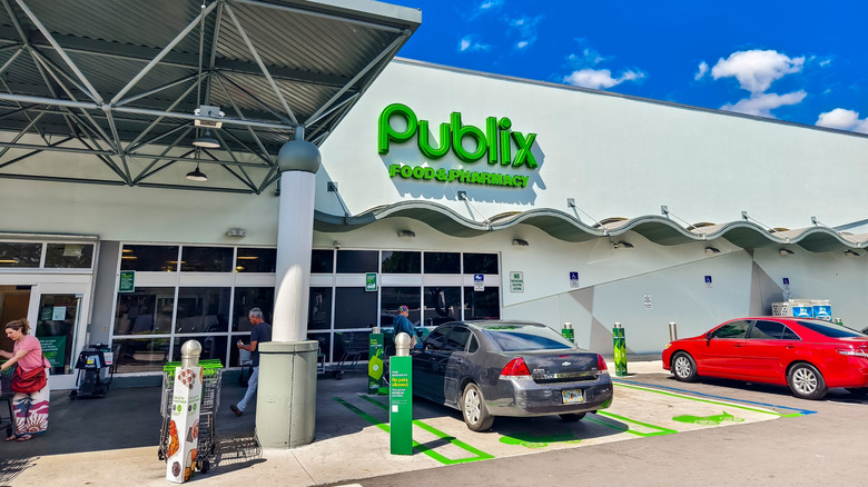 Shoppers entering and exiting a Publix grocery store