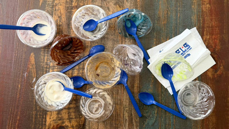 Empty ice cream cups scattered on a table