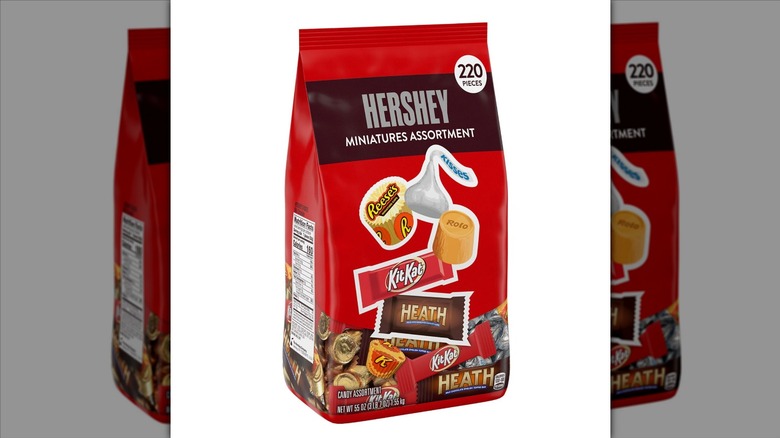 Hershey Miniatures Assortment in a red paper bag on a white background.
