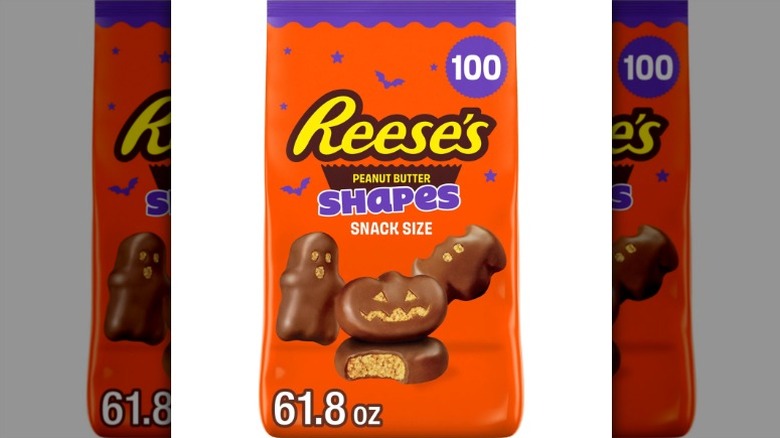A bag of snack-sized Halloween-themed Reese's Peanut Butter Shapes on a white background.