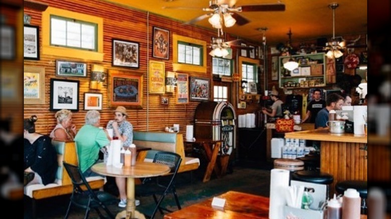 The inside of The Joint with customers sitting in booths and at the counter