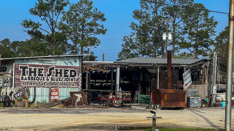 Exterior of the Shed Barbecue and Blues Joint with the sign on the left of the building