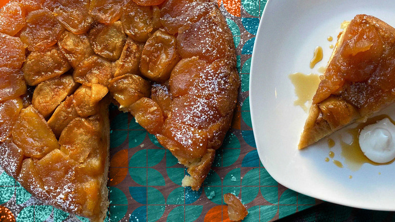 Buttermilk biscuit tarte tatin with a slice on a plate