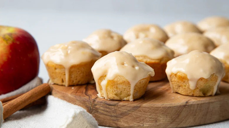 Mini-baked apple fritters on a wood board