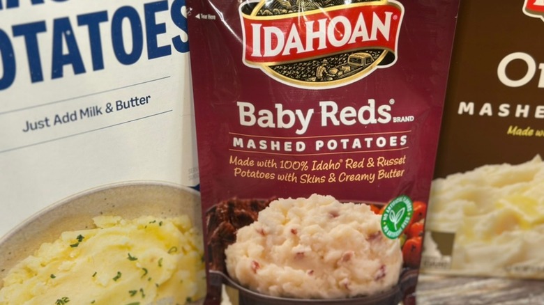 Idahoan Baby Reds package between two other instant mashed potato brands