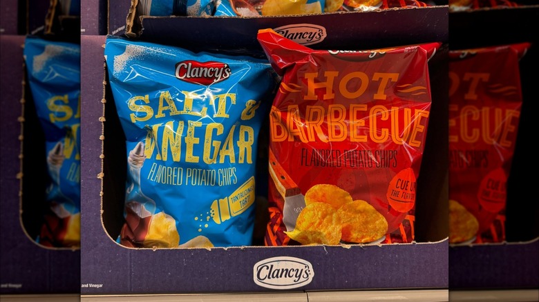 Red and blue bags of Clancy's potato chips on Aldi store shelves
