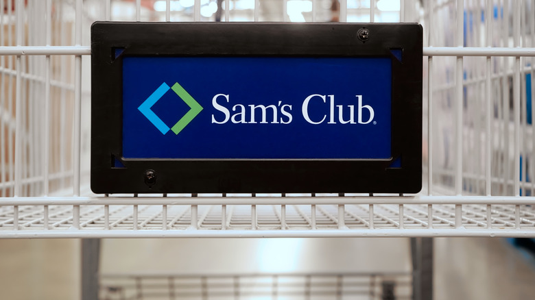 a white shopping cart with a sams club label on the front