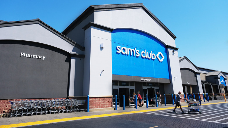 customers entering and exiting sam's club building from the outside