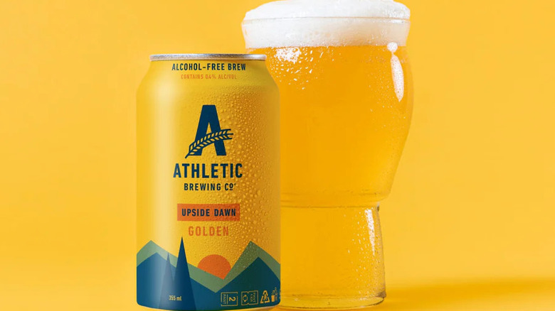 Athletic Brewing Upside Dawn Golden Ale in a can and glass