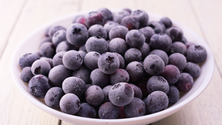 Frozen blueberries in a white bowl