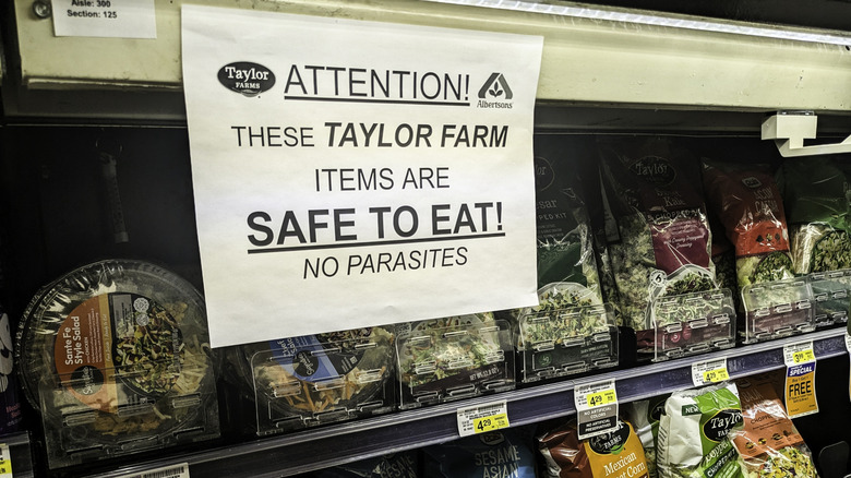 signage in grocery store regarding recently recalled lettuce