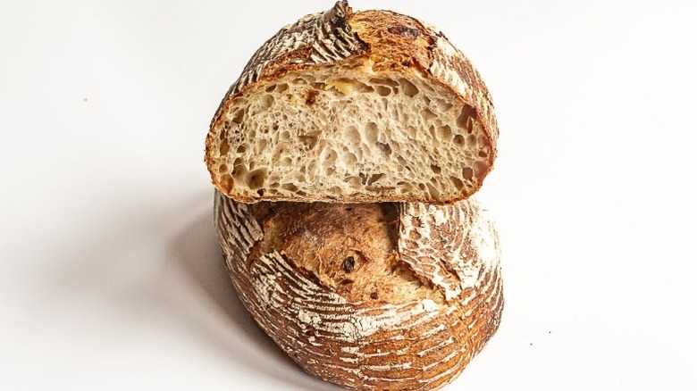 A loaf of potato sourdough bread from Grand Central Bakery Cafe cut in half with one half stacked on top of the other