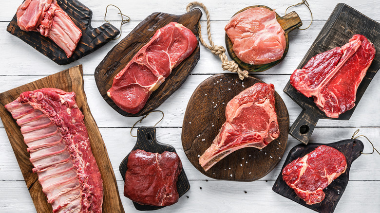 Variety of raw meats and steaks