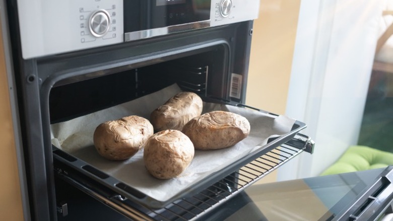 baked potatoes on tray in oven