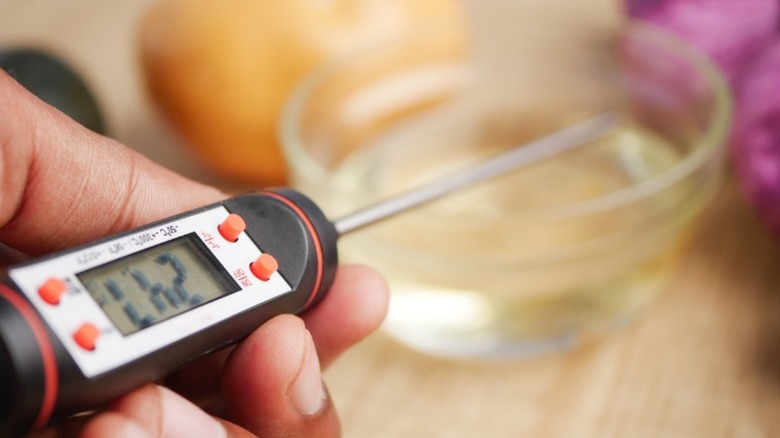cooking thermometer with ingredients in background