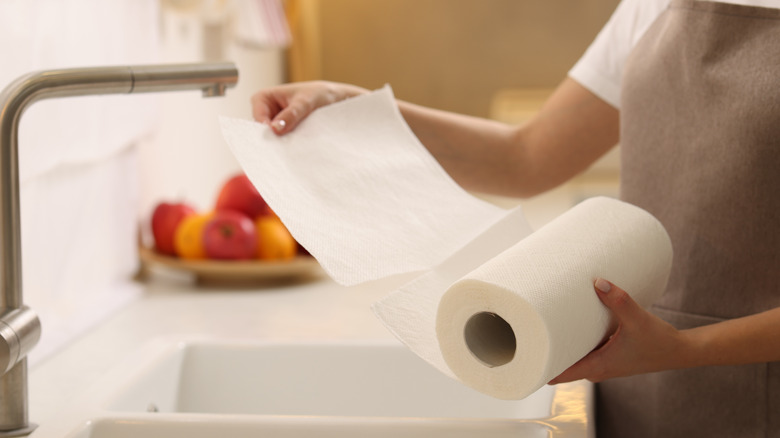 Woman using paper towels