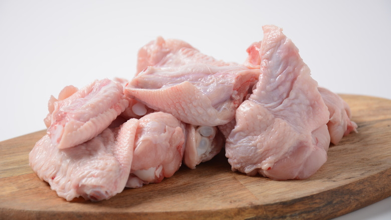 Chicken wings on a wooden board