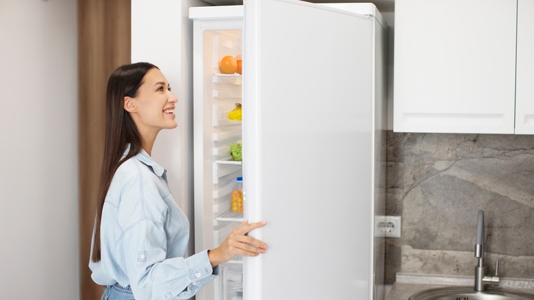 Woman looking in the fridge