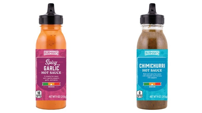 squeeze bottles of Burman's Spicy Garlic Hot Sauce and Chimichurri Hot Sauce