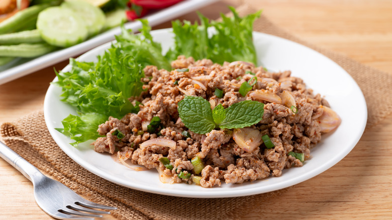 Spicy minced pork salad (Larb Moo) in a white dish