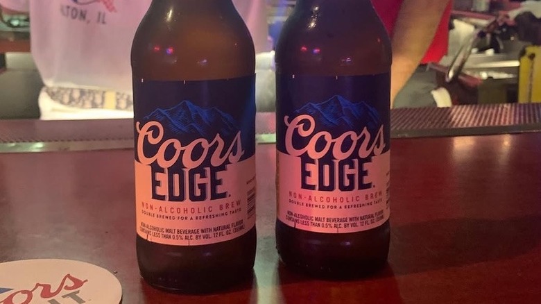 Two bottles of Coors Edge on the bar