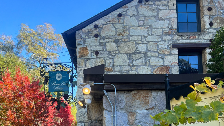 old stone building surrounded by trees