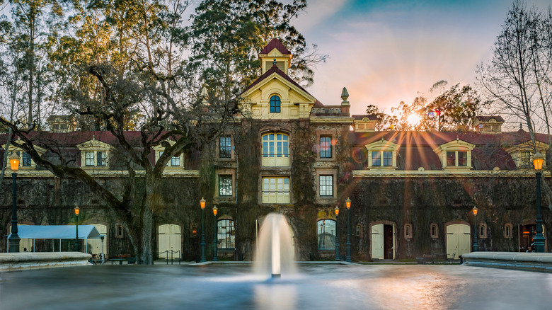 mansion with fountain in front