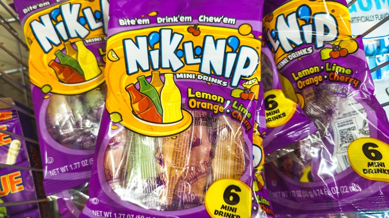 closeup of packs of Nik-L-Nip in a grocery cart