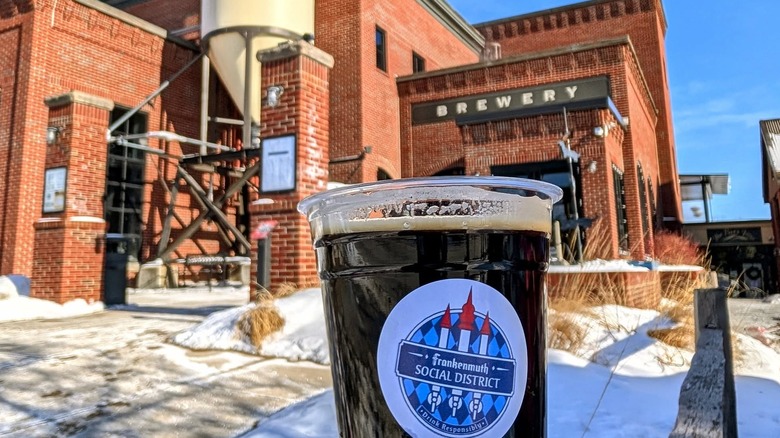 Pint of beer in front of the Frankenmuth brewery