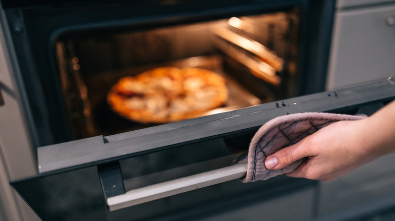Person looking in the oven