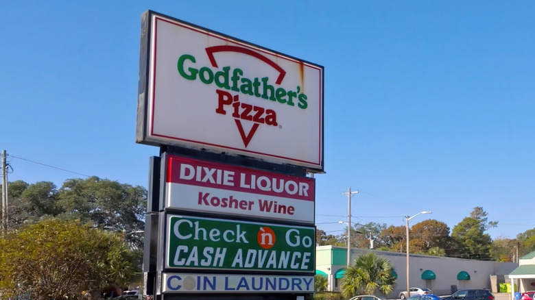 Sign for a Godfather's Pizza in a strip mall