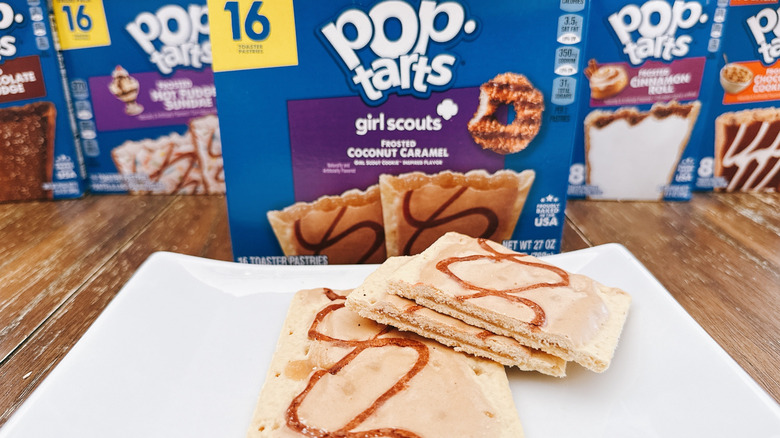 Girl Scouts Coconut Caramel Pop-Tarts cut on a plate with package in background