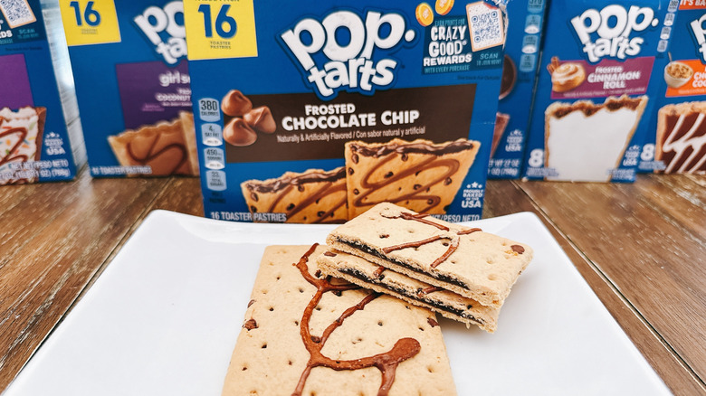 Frosted Chocolate Chip pop-tart cut on a plate with package in background