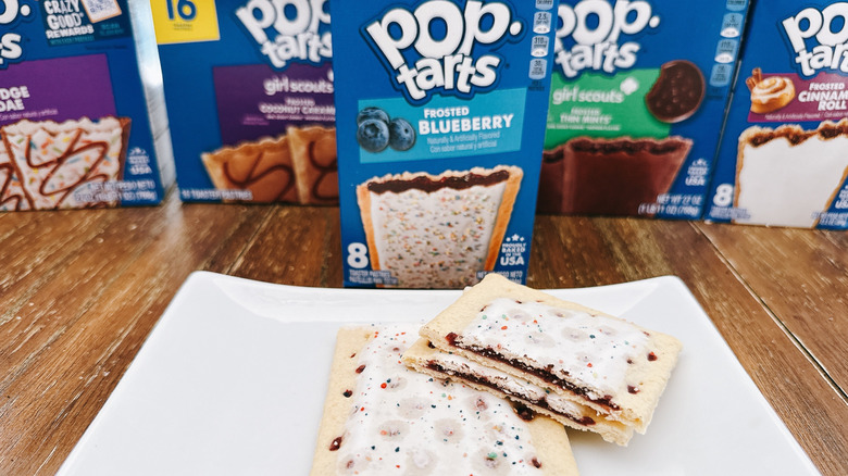 Blueberry Pop Tarts cut on a plate with package in background