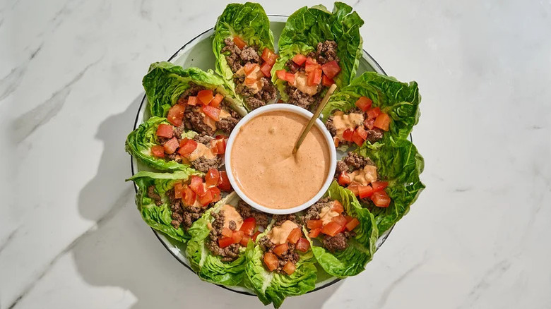 Burger deluxe lettuce wraps with a dipping sauce