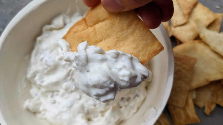 Onion dip in a bowl with crackers