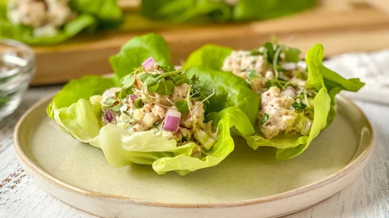 Tuna lettuce wraps on a white plate
