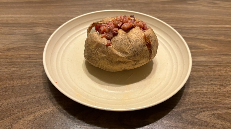 baked potato with bacon on plate