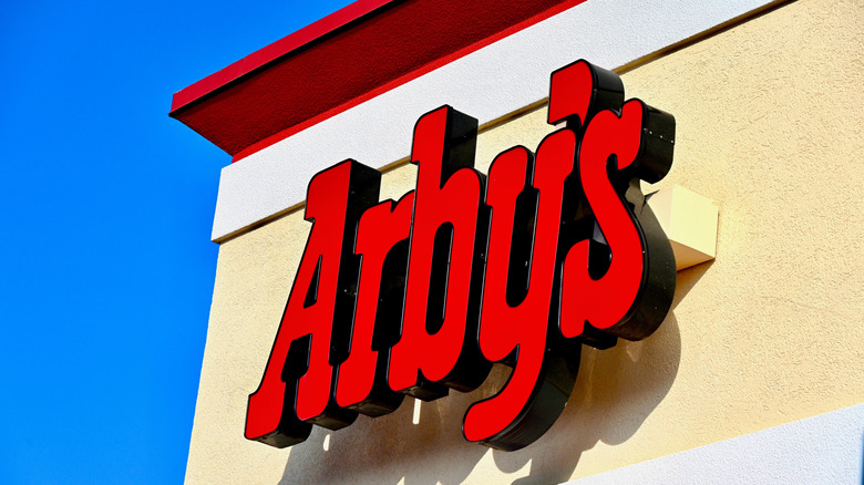 Arby's sign on the outside of a store in daylight