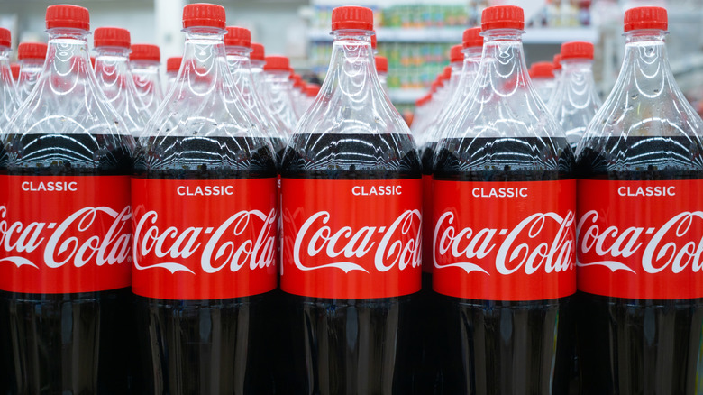 Bottle of Coca-Cola on display in a supermarket