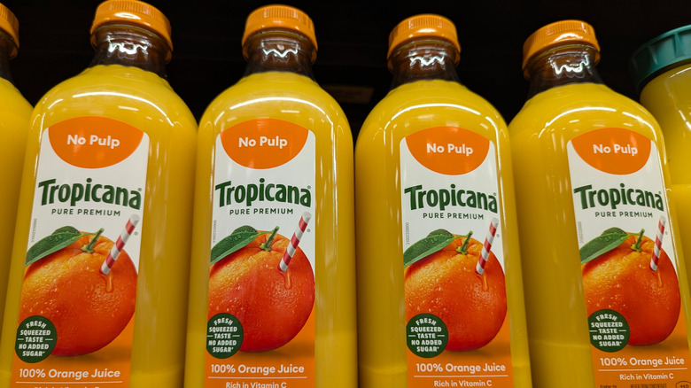 A line of Tropicana orange juice on display at a store