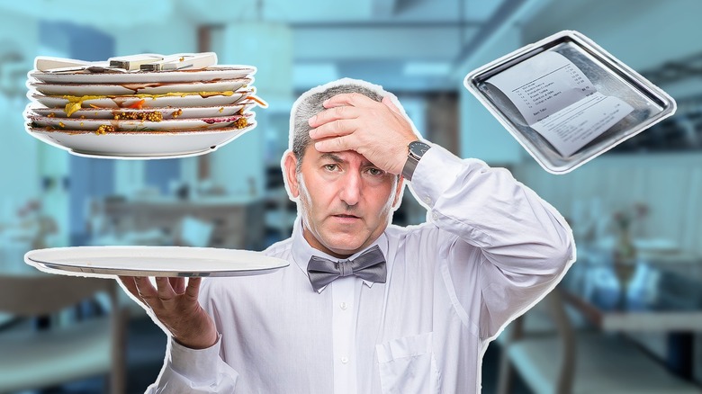 Composite image of busy waiter looking stressed out with his hand on his head, holding a tray