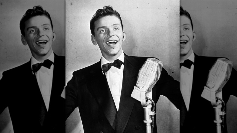 Young Frank Sinatra, singing into a Pyle-style microphone and wearing a black tuxedo